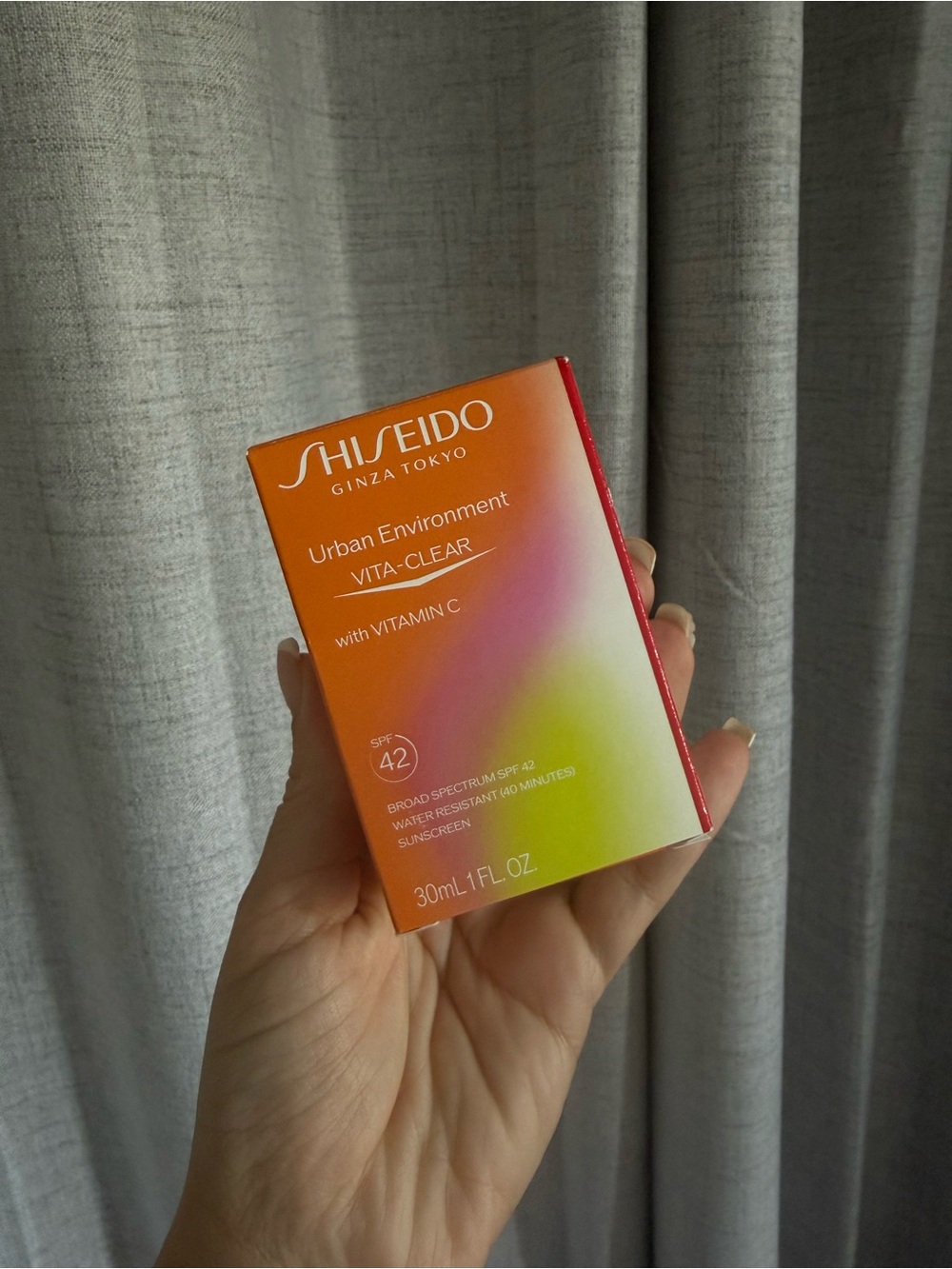 Shiseido Vita-Clear SPF 42 Sunscreen with bag holder